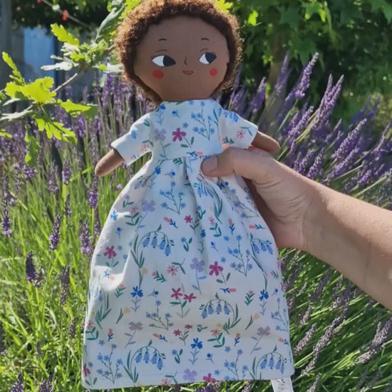 Video showing how the Flowers & Vichy reversible handmade doll flips to reveal the second character